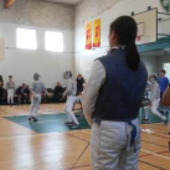 coaching advice at a fencing tournament